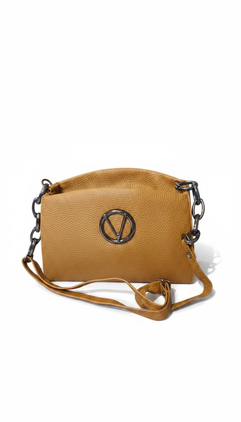 Bmart barihat tan pebbled leather crossbody bag with a circular silver logo emblem and chain link strap details.
