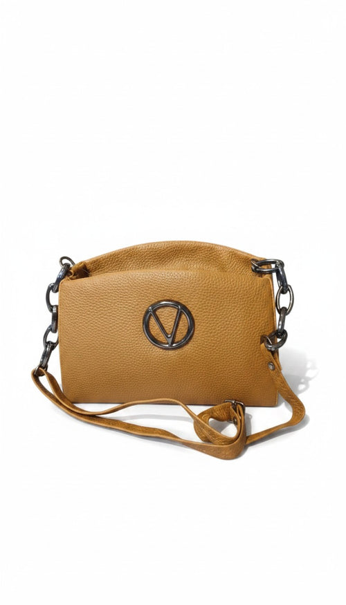 Bmart barihat tan pebbled leather crossbody bag with a circular silver logo emblem and chain link strap details.